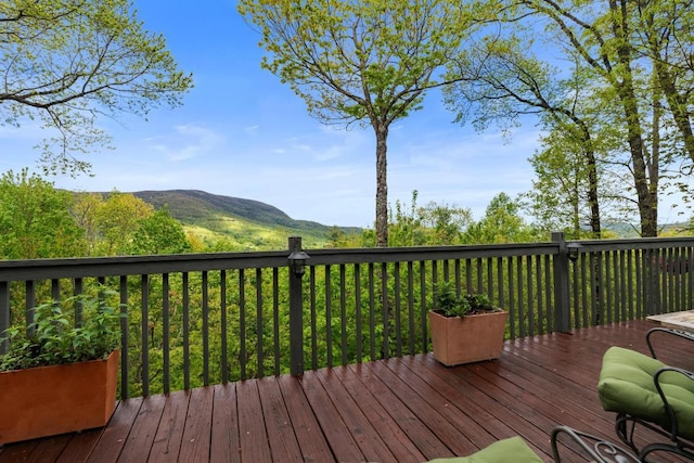 wooden terrace with a mountain view