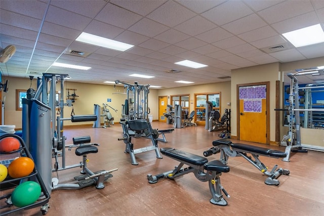 exercise room with a drop ceiling