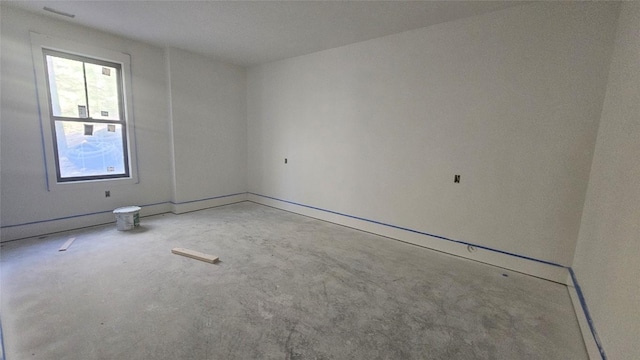 empty room featuring unfinished concrete flooring