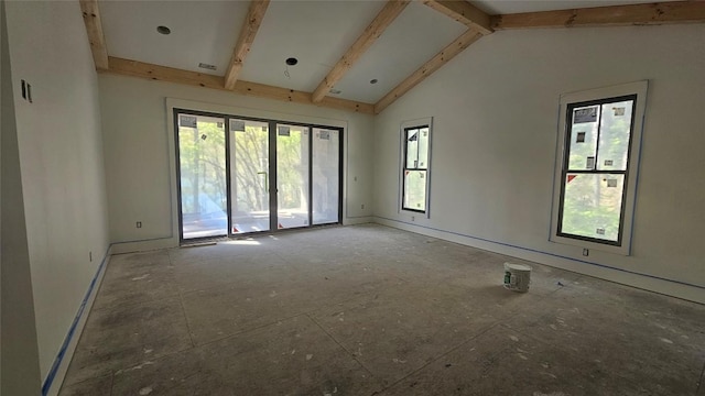 empty room with baseboards and vaulted ceiling with beams