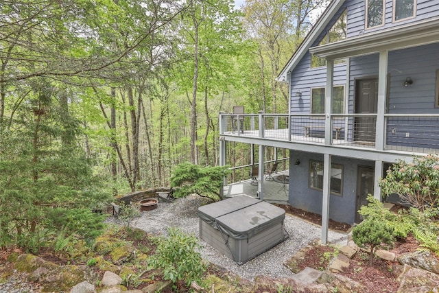 exterior space with a view of trees and a balcony
