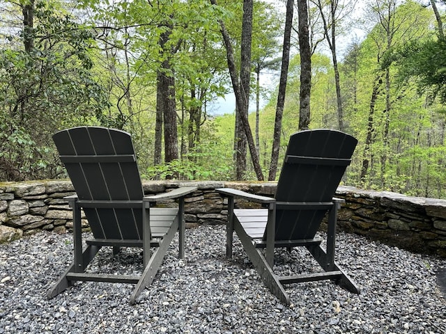 view of patio / terrace featuring a forest view