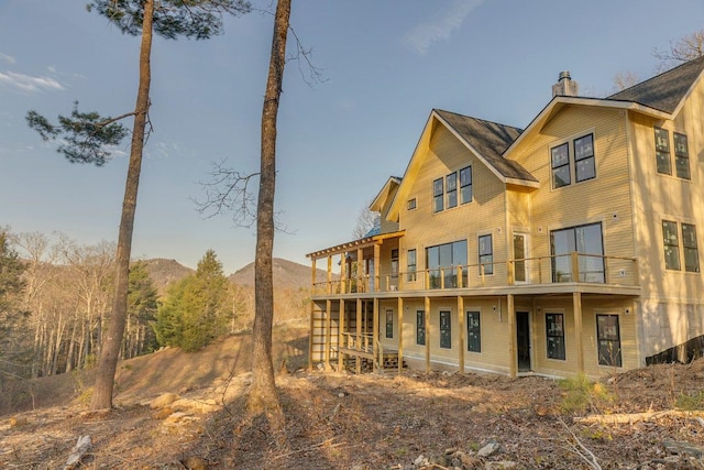 164 Wildcat Ln, Cashiers, NC 28717 - rear view of property featuring a chimney and a balcony