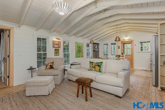 sunroom featuring vaulted ceiling with beams and wooden ceiling