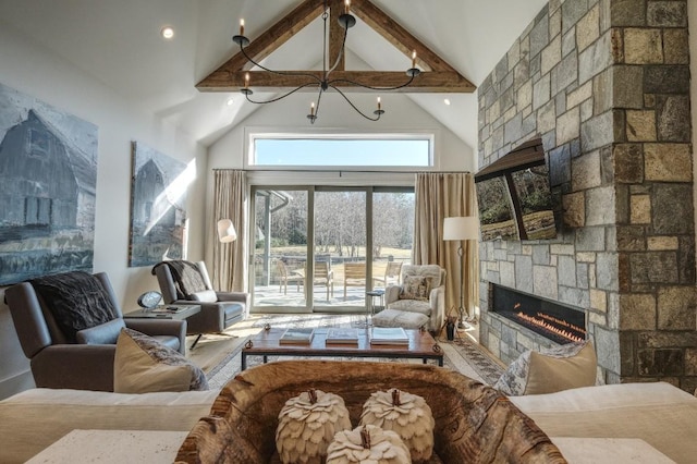 living area with beamed ceiling, a fireplace, and high vaulted ceiling