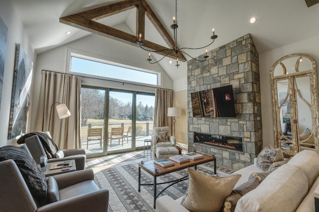 living room with an inviting chandelier, high vaulted ceiling, a stone fireplace, and a healthy amount of sunlight