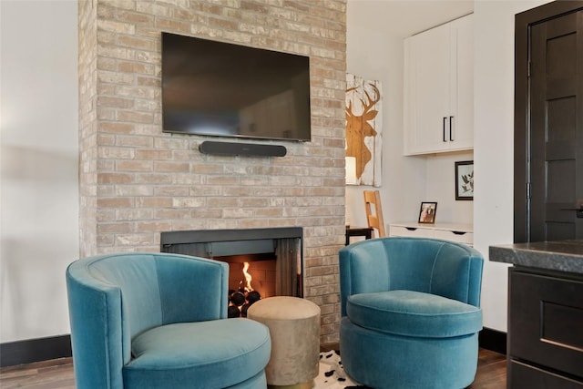 46 Zermatt Cir, Highlands, NC 28741 - living area with wood finished floors, a brick fireplace, and baseboards