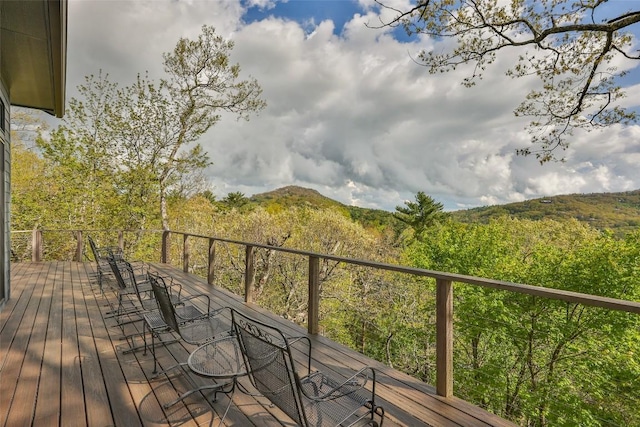 46 Zermatt Cir, Highlands, NC 28741 - wooden deck with outdoor dining area and a wooded view