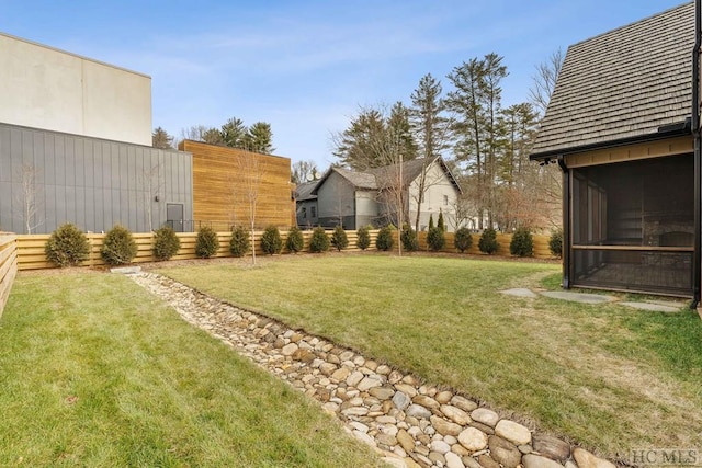 view of yard with a sunroom