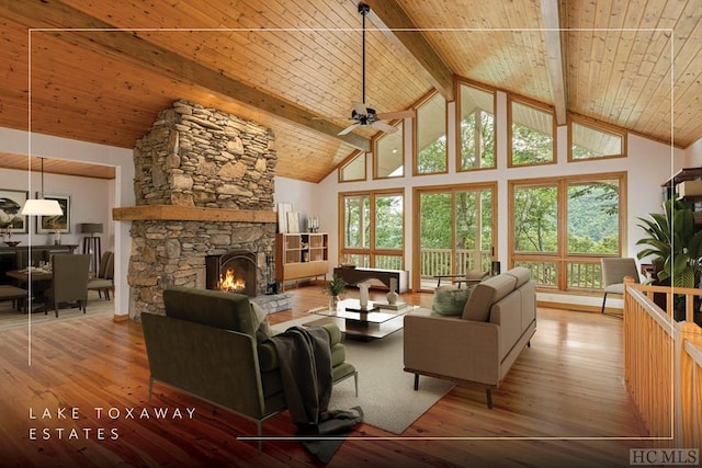 living room with high vaulted ceiling, a fireplace, hardwood / wood-style flooring, wood ceiling, and beam ceiling