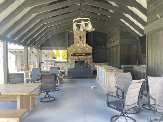 view of patio featuring area for grilling, a grill, a gazebo, and an outdoor stone fireplace