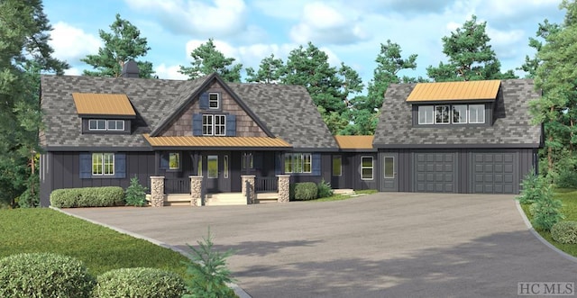 view of front of property with a garage and covered porch