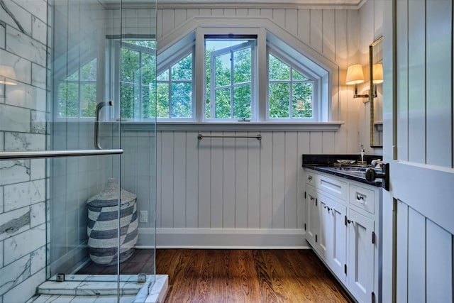 581 Sagee Woods Dr, Highlands, NC 28741 - bathroom with plenty of natural light, wood finished floors, vanity, and a stall shower