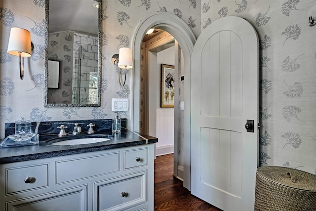 581 Sagee Woods Dr, Highlands, NC 28741 - bathroom featuring wallpapered walls, wood finished floors, and vanity