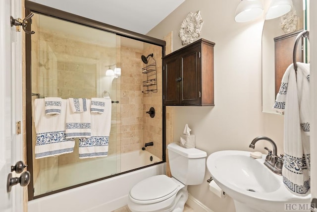 bedroom with light wood-type flooring and ensuite bathroom