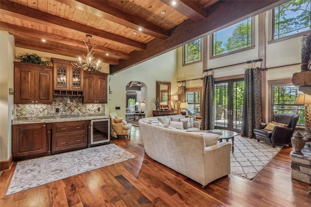 18 Buck Knob Is, Glenville, NC 28723 - living room with wine cooler, arched walkways, dark wood-type flooring, wood ceiling with exposed beams, and a chandelier
