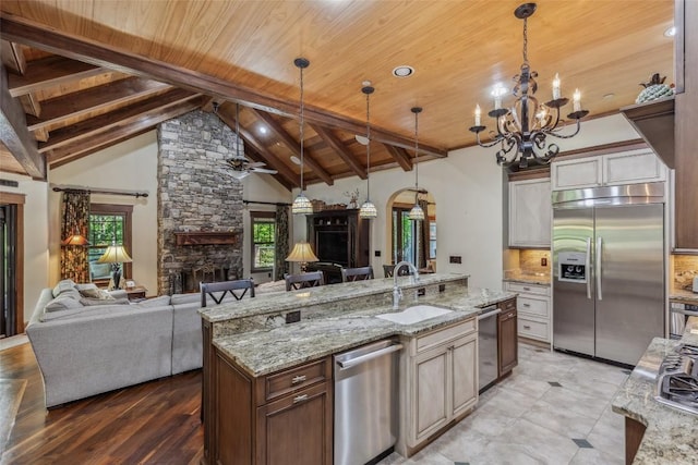 18 Buck Knob Is, Glenville, NC 28723 - kitchen with appliances with stainless steel finishes, wood ceiling with exposed beams, a sink, open floor plan, and a chandelier