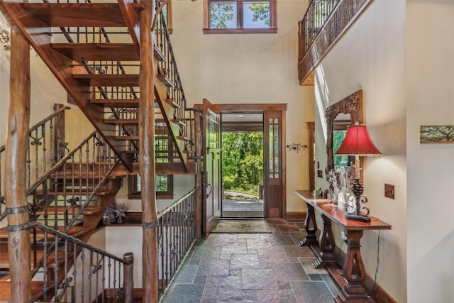 18 Buck Knob Is, Glenville, NC 28723 - foyer entrance featuring stone tile floors, a high ceiling, baseboards, and stairway