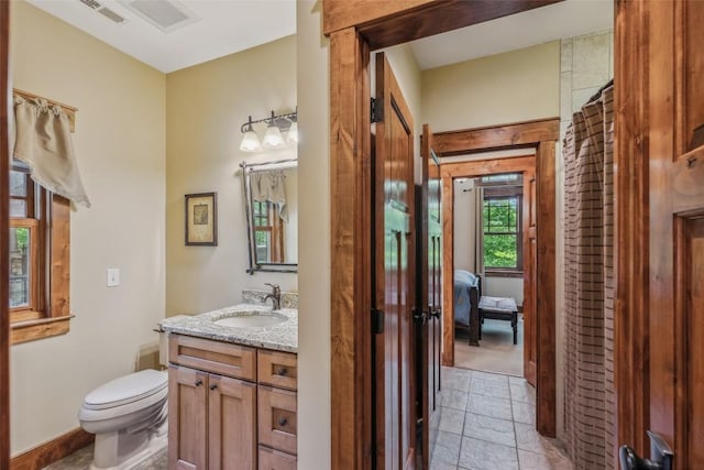 18 Buck Knob Is, Glenville, NC 28723 - bathroom with vanity, toilet, and stone tile floors