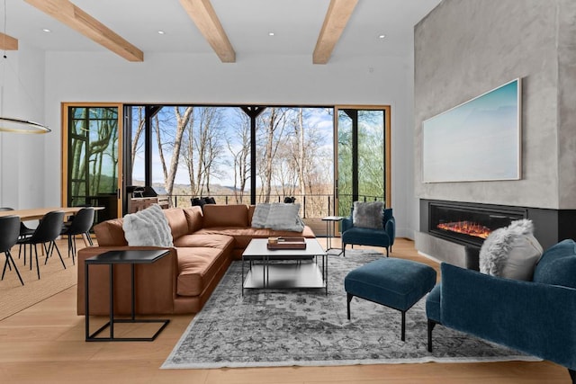 99 Springhead Trl, Cullowhee, NC 28723 - living area with beam ceiling, recessed lighting, light wood-type flooring, and a glass covered fireplace