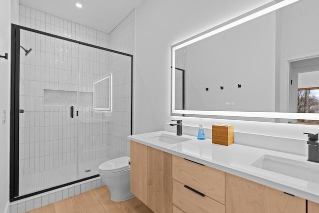 99 Springhead Trl, Cullowhee, NC 28723 - bathroom featuring a shower stall, double vanity, a sink, and toilet