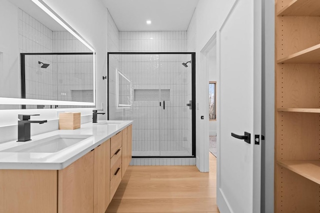 99 Springhead Trl, Cullowhee, NC 28723 - bathroom featuring a sink, a stall shower, and wood finished floors