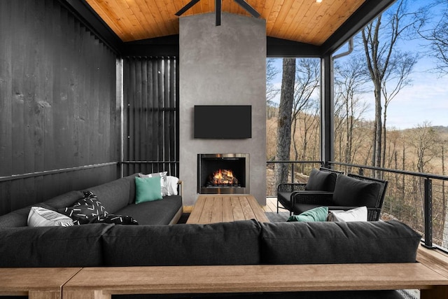 99 Springhead Trl, Cullowhee, NC 28723 - living room featuring a warm lit fireplace, wooden ceiling, lofted ceiling, and expansive windows