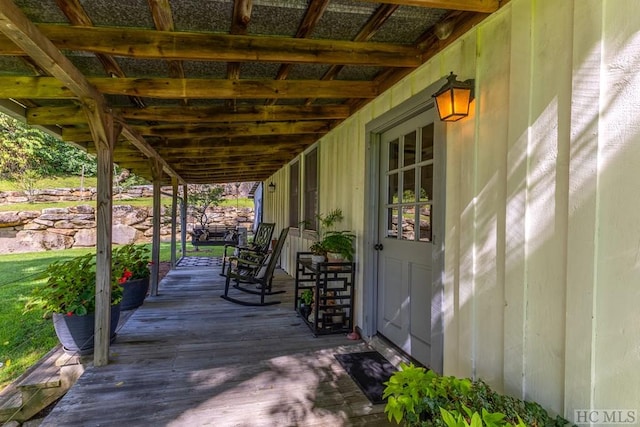 wooden terrace with a porch