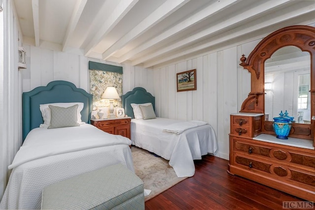 bedroom featuring dark hardwood / wood-style flooring and beam ceiling