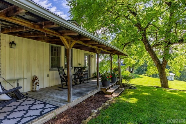 wooden deck with a yard