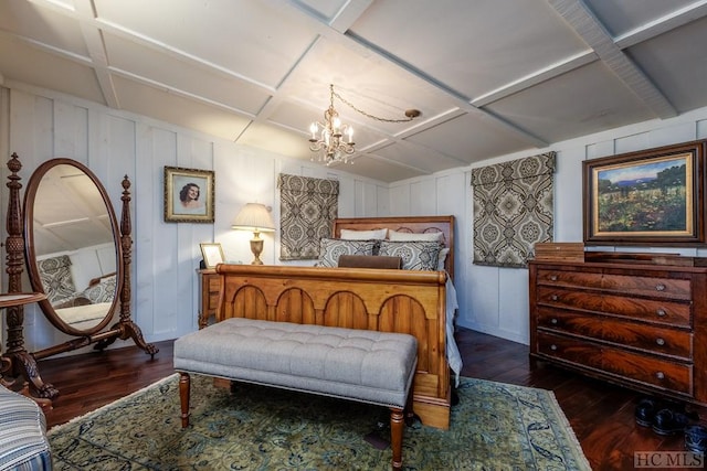 bedroom with dark hardwood / wood-style floors and a chandelier