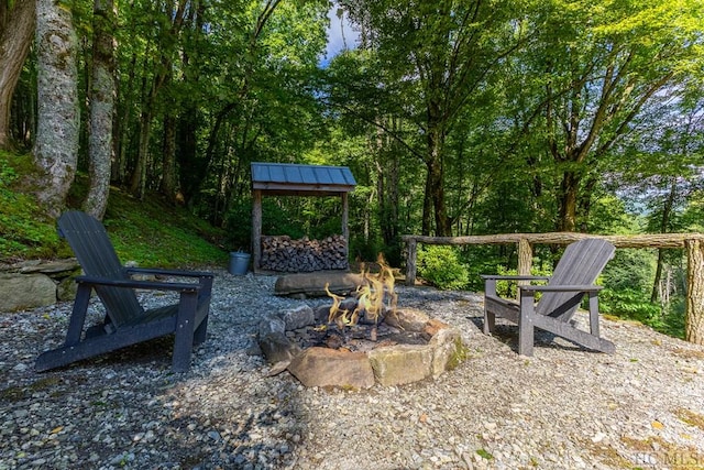 view of yard with an outdoor fire pit