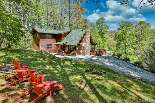 view of yard with a wooden deck