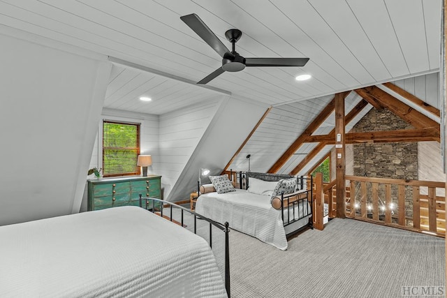 carpeted bedroom with ceiling fan, vaulted ceiling with beams, and wooden ceiling