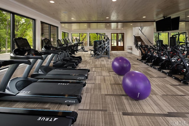 exercise room with carpet, french doors, and wooden ceiling