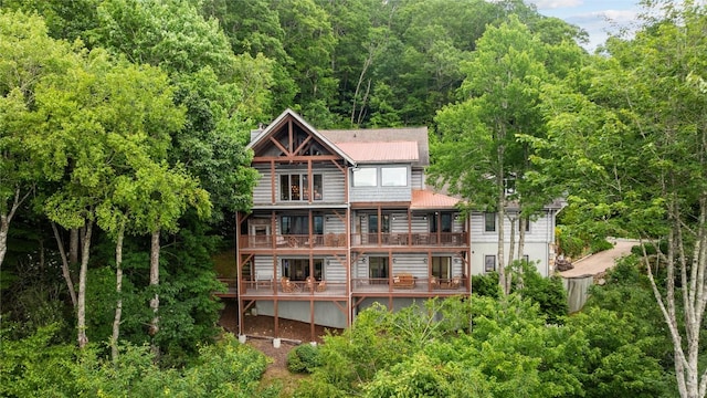 57 Loch Dr, Glenville, NC 28736 - rear view of property with a balcony, a metal roof, and a forest view