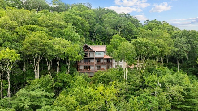 57 Loch Dr, Glenville, NC 28736 - view of subject property with a heavily wooded area