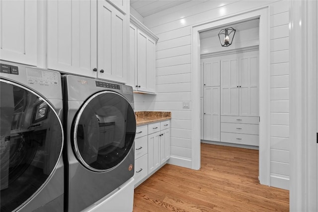 57 Loch Dr, Glenville, NC 28736 - laundry room featuring washer and dryer, cabinet space, and light wood finished floors