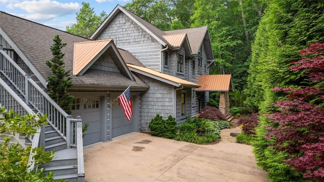 57 Loch Dr, Glenville, NC 28736 - view of front facade featuring stairs, a standing seam roof, concrete driveway, and roof with shingles