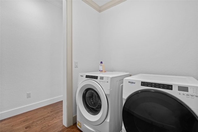 57 Loch Dr, Glenville, NC 28736 - washroom featuring washer and dryer, ornamental molding, and wood finished floors