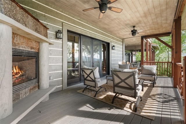 57 Loch Dr, Glenville, NC 28736 - wooden terrace featuring a ceiling fan and an outdoor living space with a fireplace