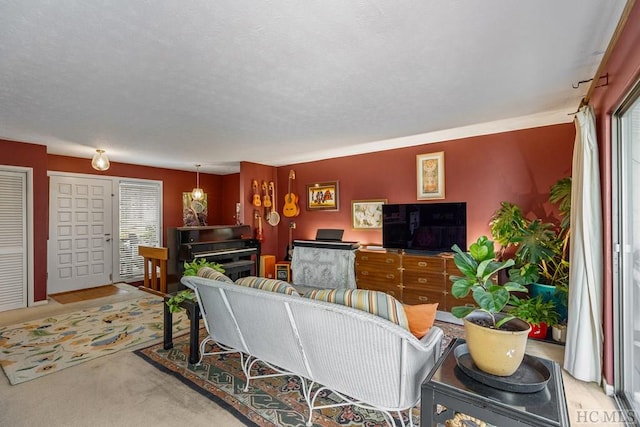 living room with light colored carpet and a textured ceiling