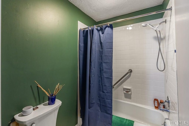 bathroom featuring shower / bath combination with curtain, a textured ceiling, and toilet