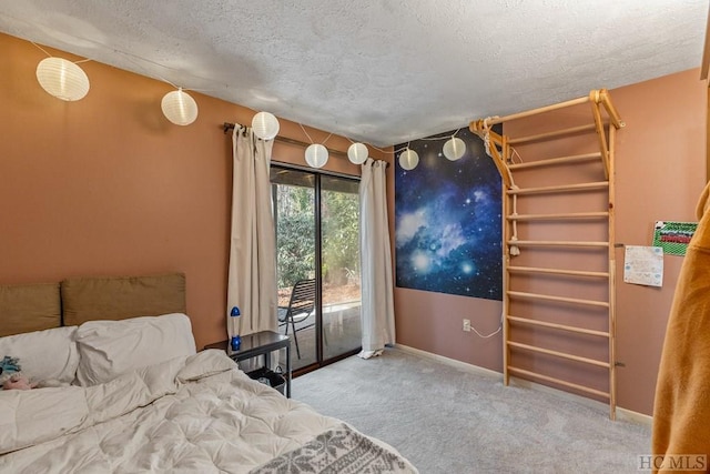 bedroom with carpet flooring, access to exterior, and a textured ceiling