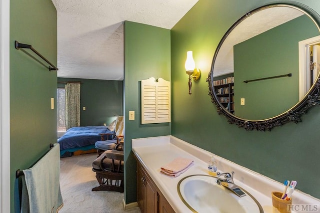 bathroom with vanity and a textured ceiling