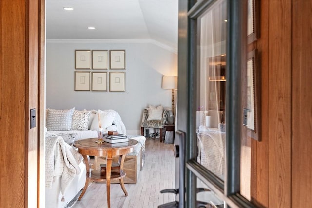 interior space featuring recessed lighting, ornamental molding, and light wood finished floors
