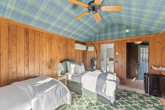 bedroom featuring wood walls, ceiling fan, lofted ceiling, and a wall mounted air conditioner