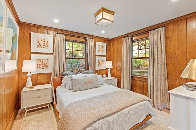 bedroom with recessed lighting and wooden walls