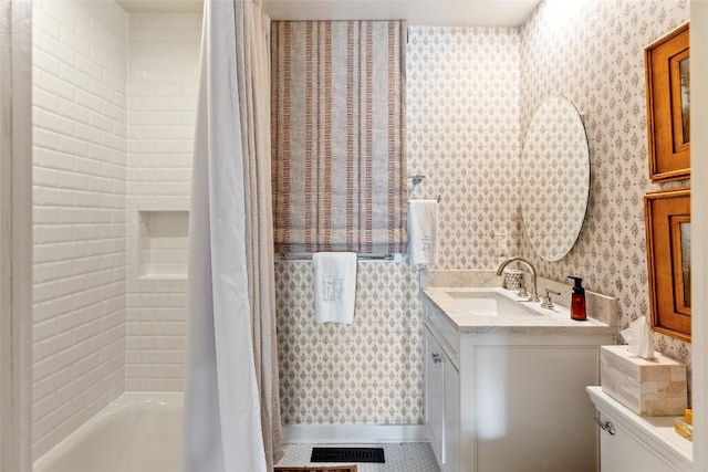 bathroom featuring vanity, shower / bath combo, visible vents, and wallpapered walls