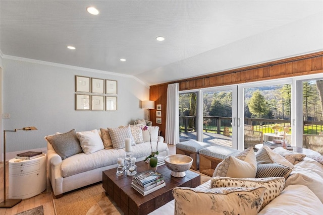 living area featuring crown molding, light wood-type flooring, recessed lighting, and lofted ceiling